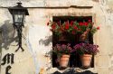 Flower pots in the window of a building in the village of Santillana del Mar, Cantabria, Spain.