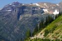 Red Jammer bus on the Going-to-the-Sun Road in Glacier National Park, Montana, USA.