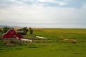 Red barn and farmland south of Pincher Creek, Alberta, Canada.