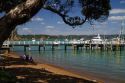 Pier and boats docked in the waterfront town of Russell on the Bay of Islands, North Island, New Zealand.
