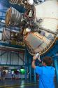 Boy taking a photo on his cellphone of the Saturn Rocket at John F. Kennedy Space Center, Merritt Island, Florida, USA.