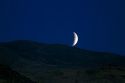 Lunar eclipse rising in the night sky above Boise, Idaho, USA.