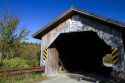 Hopkins Covered Bridge crossing the Trout River in Enosburg, Vermont, USA.